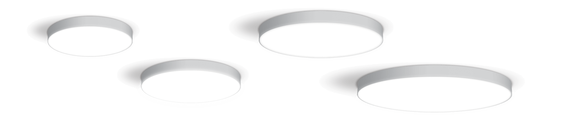 4 white round surface mount fixtures on a ceiling