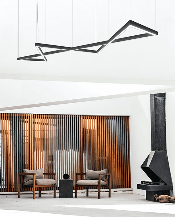 Pendant light with 4 triangles connected hanging in a modern home