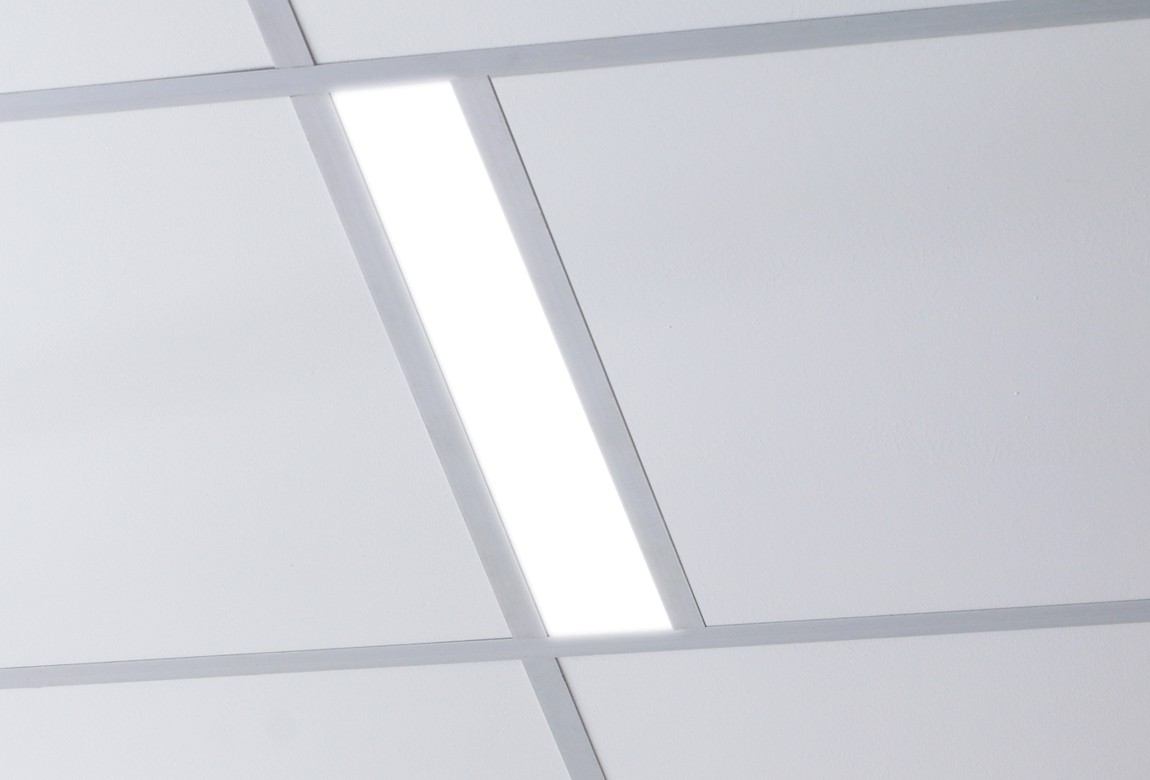 line of recessed lighting installed in a t-grid ceiling