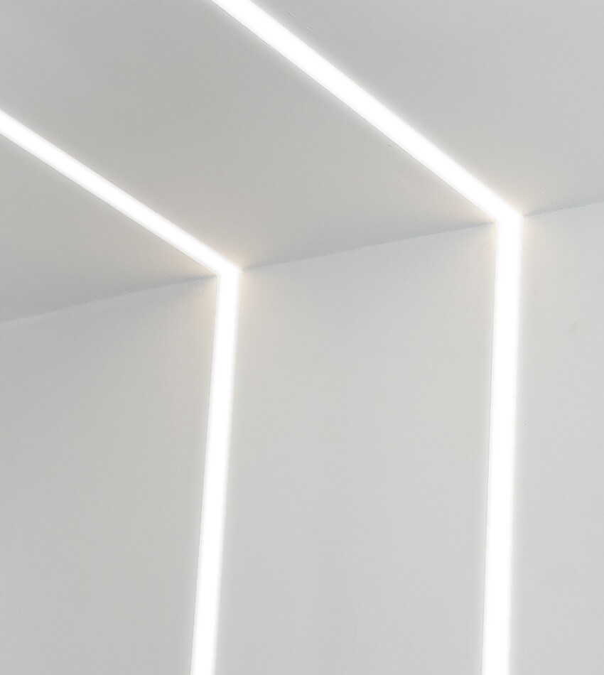 2 linear lights on the ceiling and continue along the wall
